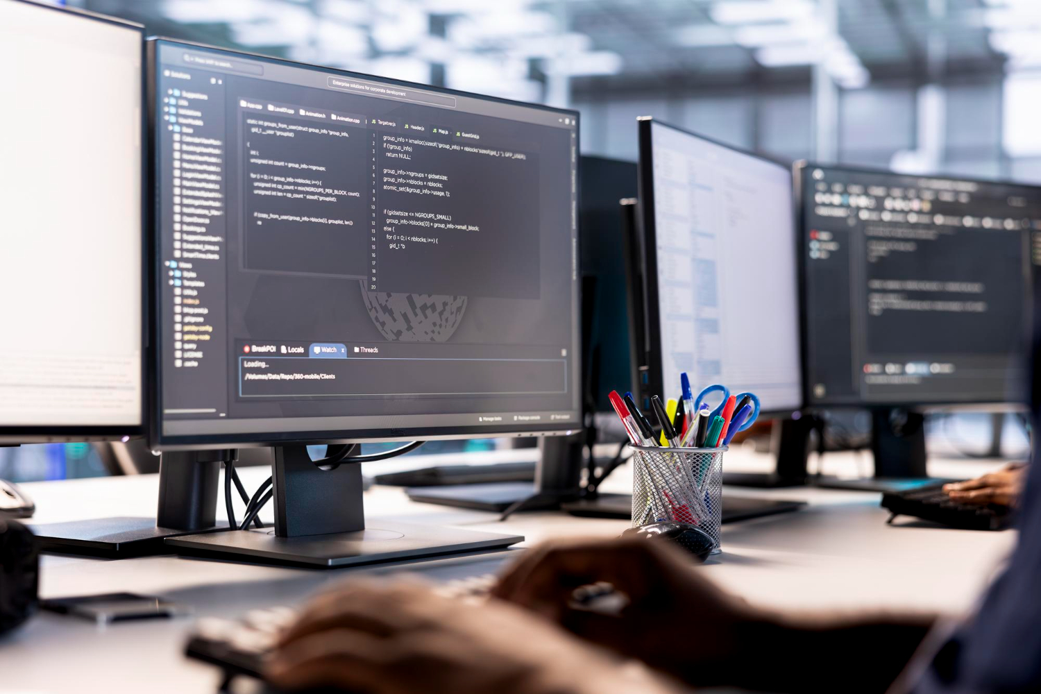 Team of IT professionals working on custom software solutions for clients in action